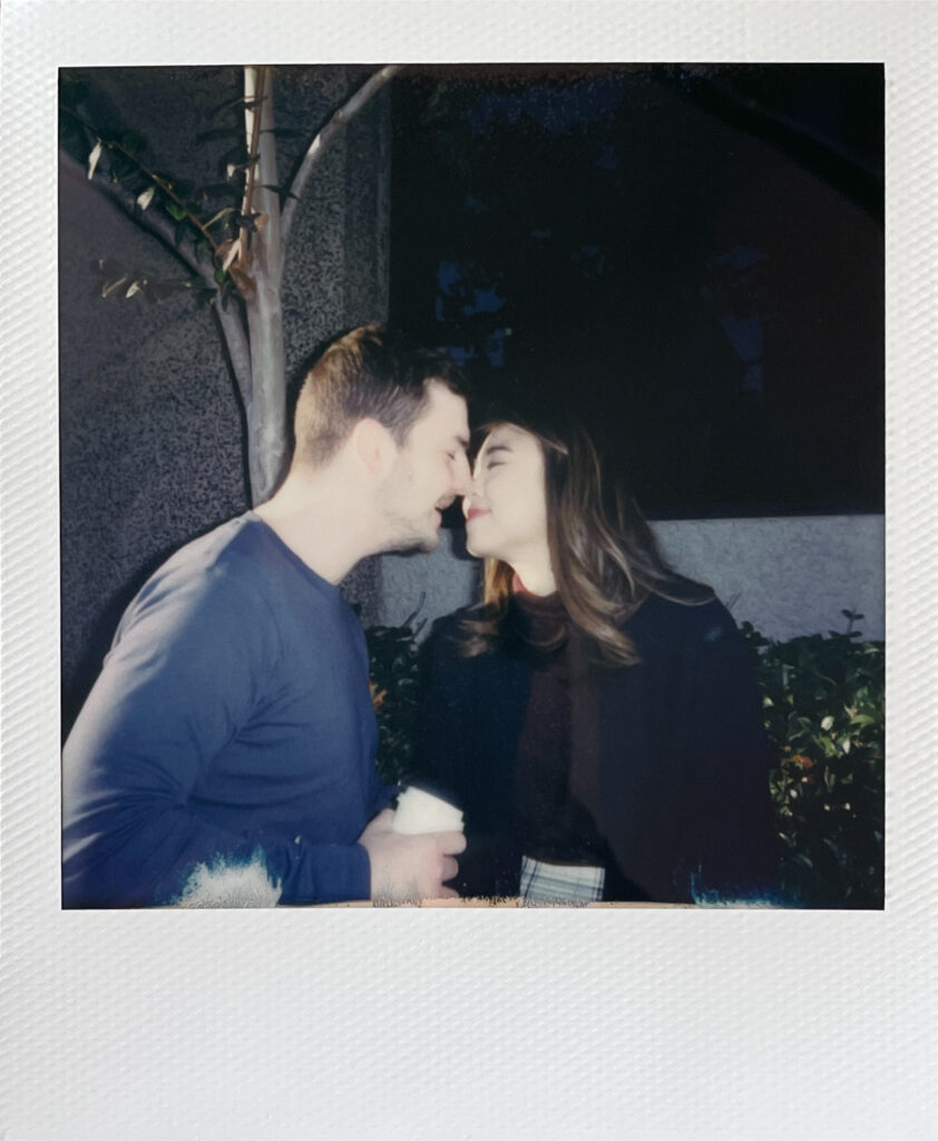 couple kissing on polaroid