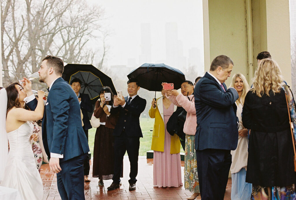 Fitzroy Gardens Intimate Wedding, Karaoke Reception, old band stand, 35mm film, wedding champagne toast