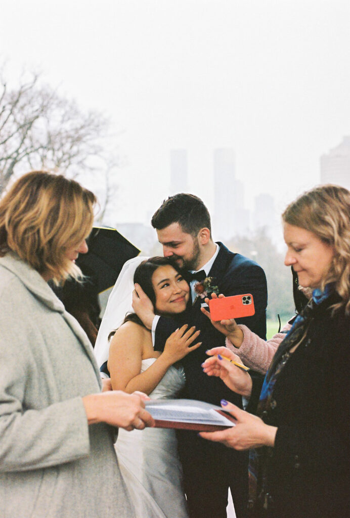 Fitzroy Gardens Intimate Wedding, Karaoke Reception, old band stand, 35mm film, signing