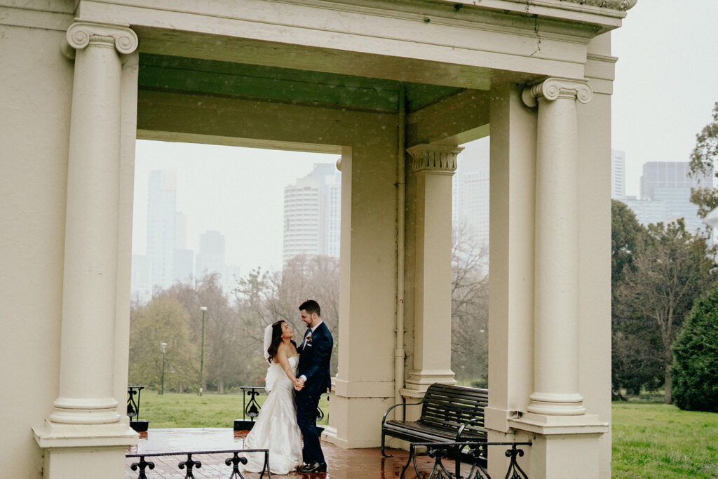 Fitzroy Gardens Intimate Wedding, Karaoke Reception, old band stand, silk wedding dress, blue suit, private dance, rainy wedding day, melbourne city wedding - 1