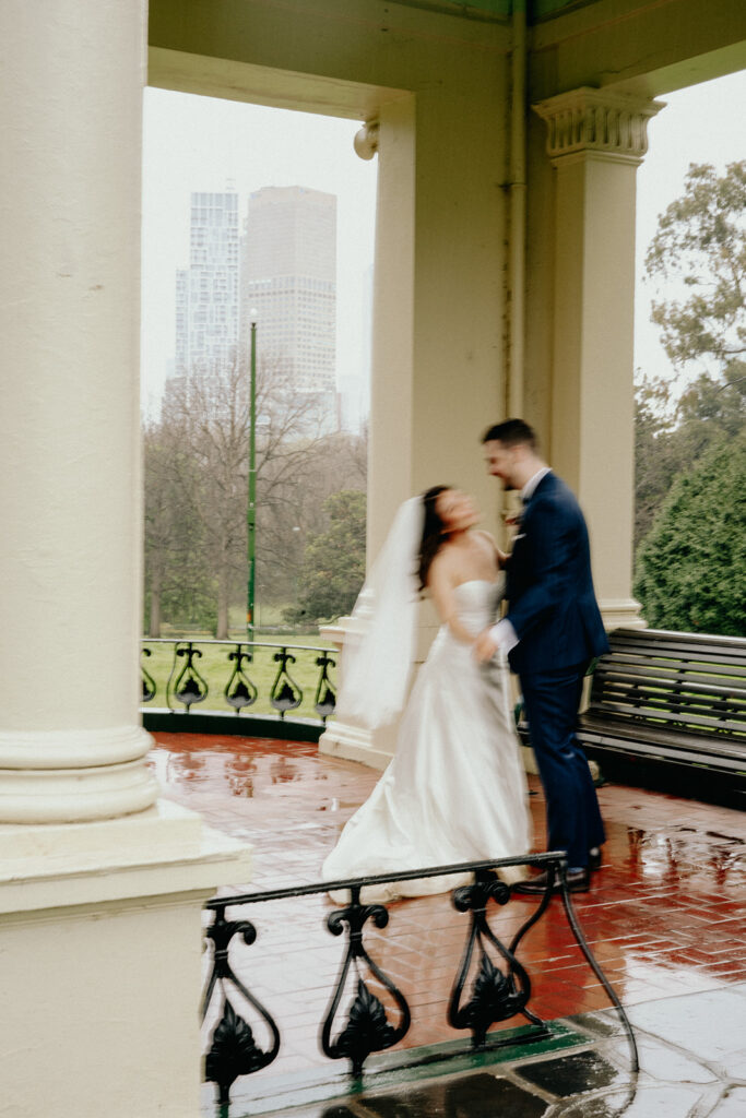 Fitzroy Gardens Intimate Wedding, Karaoke Reception, old band stand, silk wedding dress, blue suit, private dance, rainy wedding day, melbourne city wedding - 2