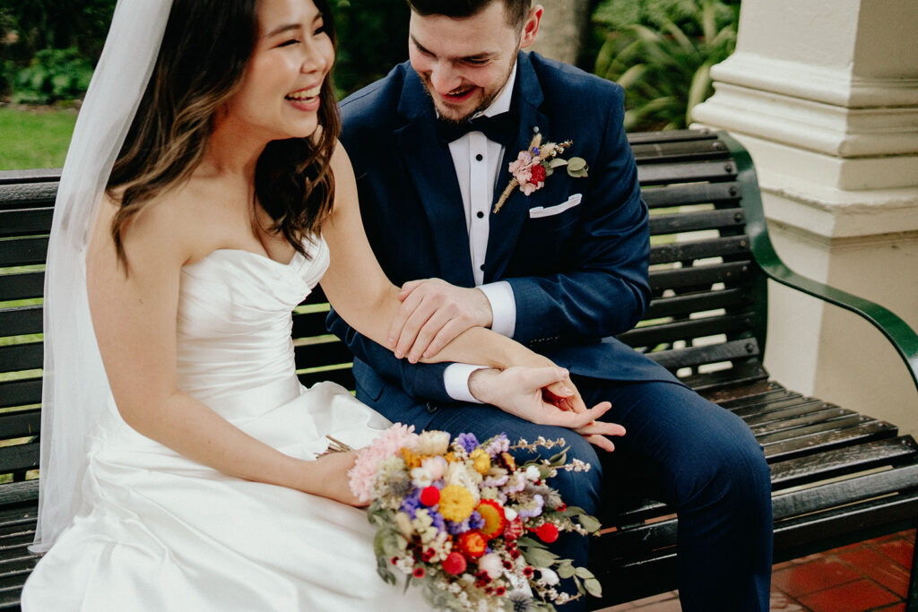 Fitzroy Gardens Intimate Wedding, Karaoke Reception, old band stand, silk wedding dress, blue suit, couple laughing - 5