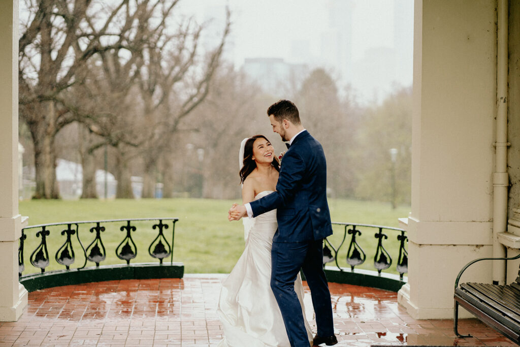 Fitzroy Gardens Intimate Wedding, Karaoke Reception, old band stand, silk wedding dress, blue suit, private dance, rainy wedding day, melbourne city wedding - 4