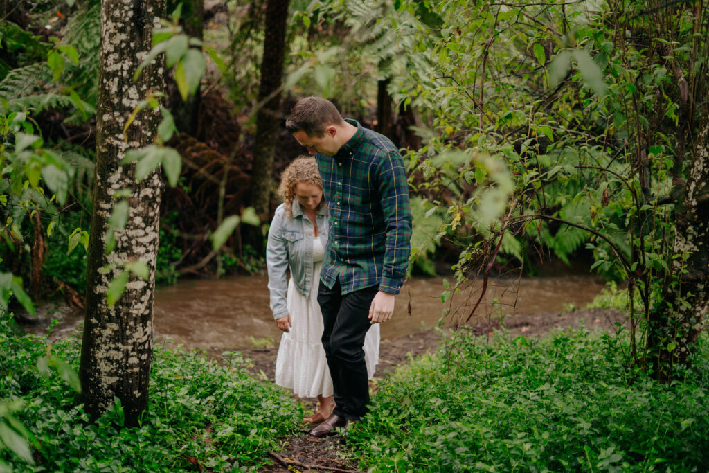 A couple exploring the picnic ground and the river during in Dandenong Ranges