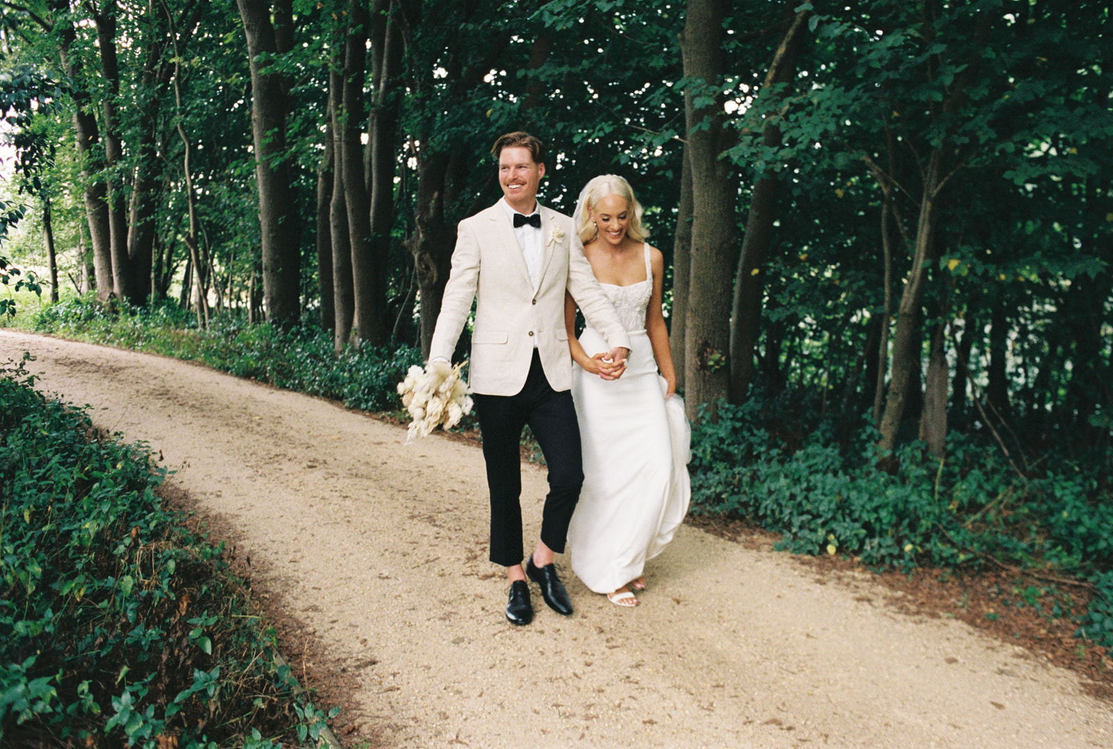 35mm film photo of Isaac & Hannah just married at Mewburn Park Estate