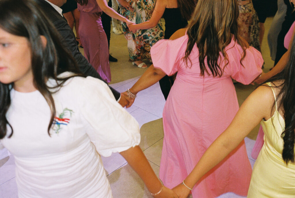 Guests dancing on the dancefloor at the wedding venue Carousel Albert Park