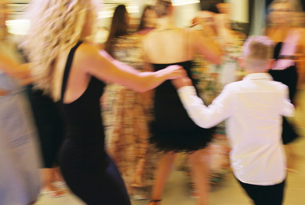 Guests dancing on the dancefloor at the wedding venue Carousel Albert Park