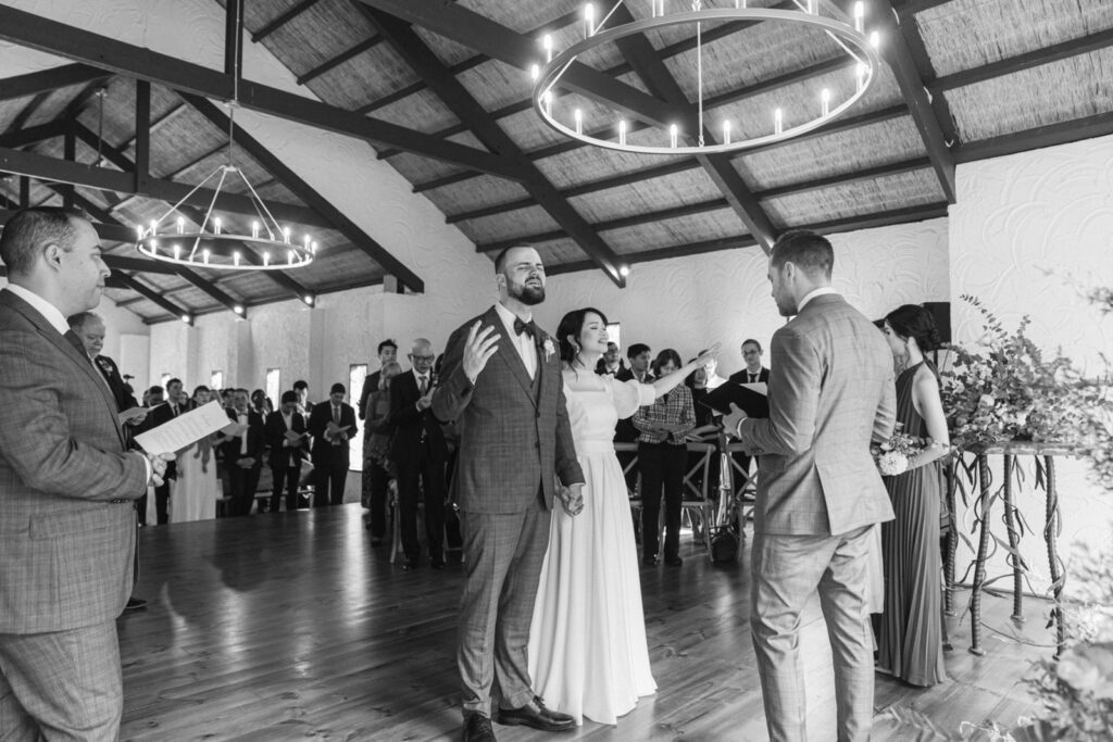 a bride and groom worshiping together on their wedding day in potters receptions chapel