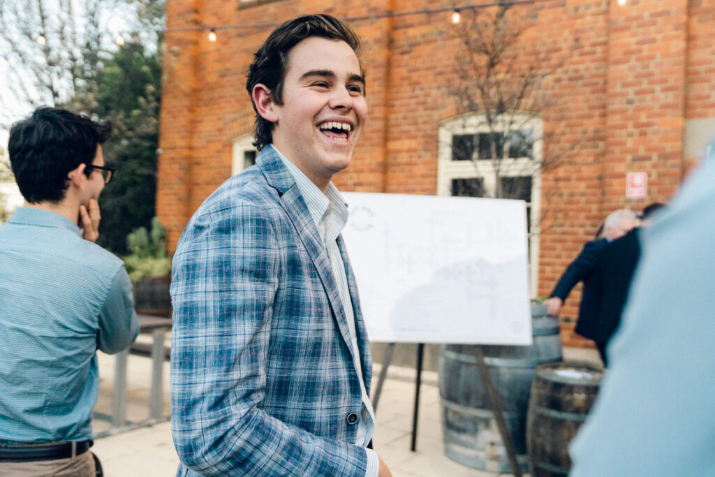 a wedding guest laughing 