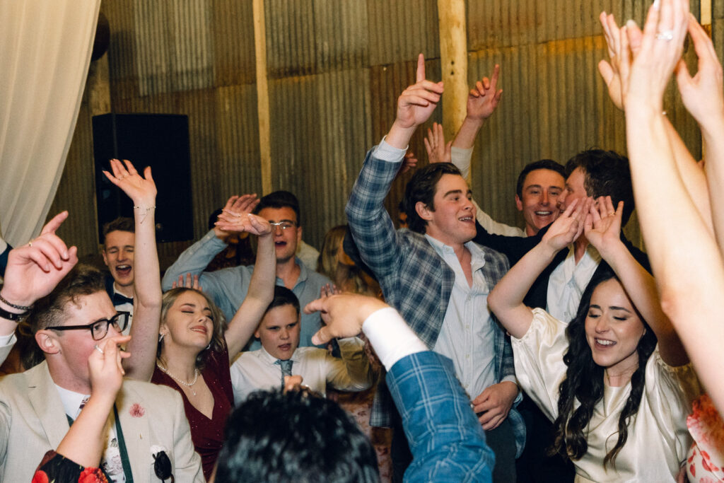 guests with their arms up and dancing on the dancefloor at corowa distillery