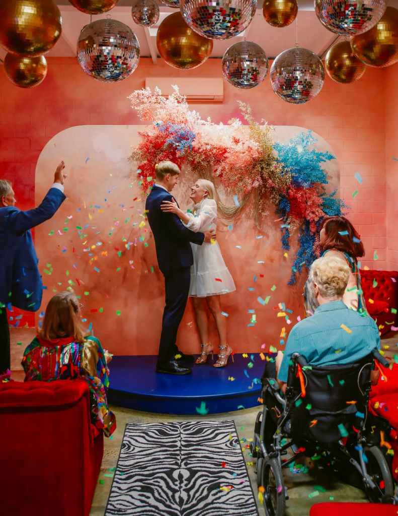 couple just married at the altar electric, the perfect Retro Wedding Venue