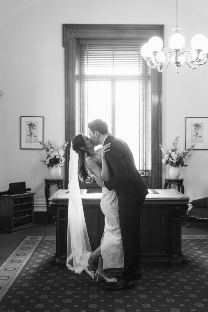 first kiss of bride and groom after their wedding ceremony at the victorian marriage registry building