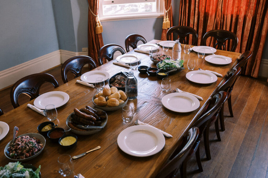 the dining table with food in the french room at ravenswood homestead