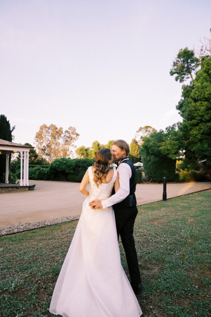 bride and groom kissing on their wedding day