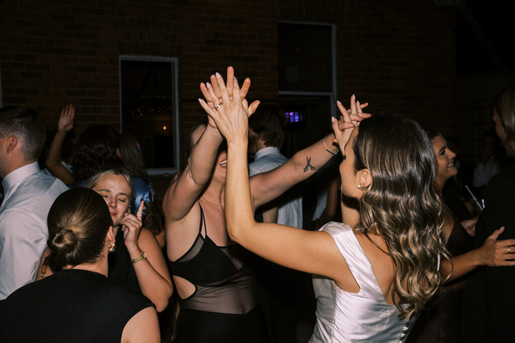 bride dancing with a wedding guest