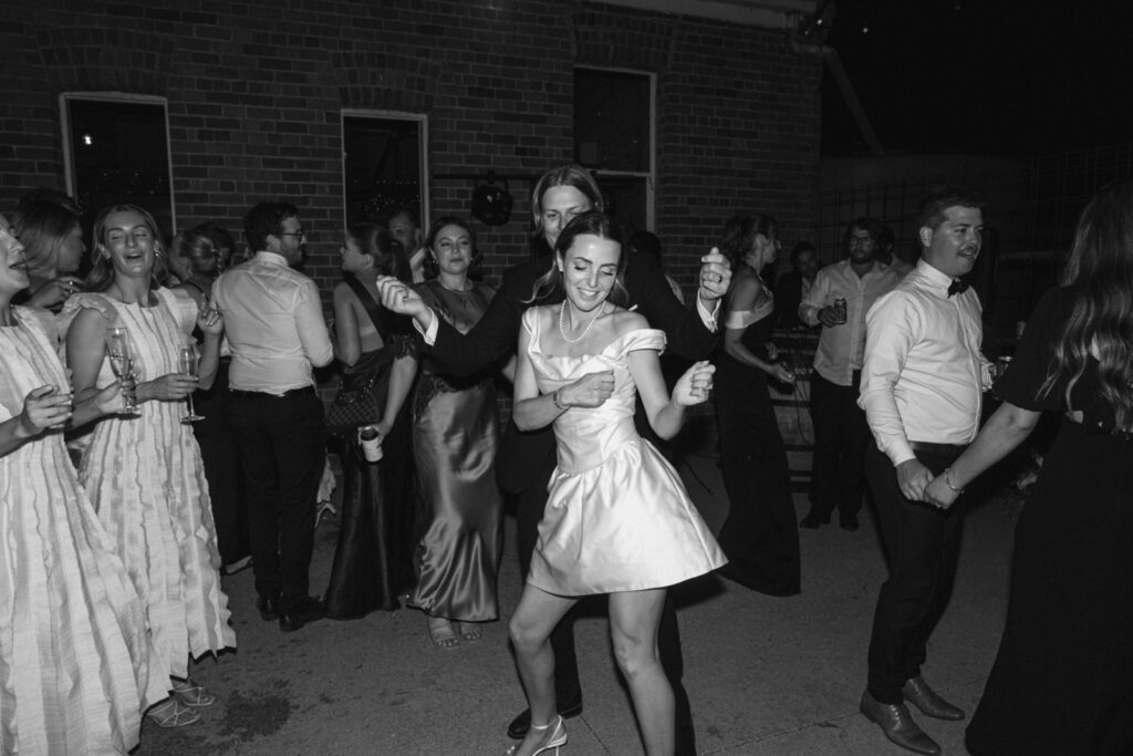 bride and groom dancing together on the dancefloor