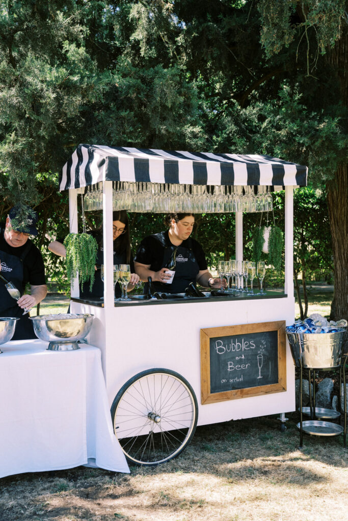 drink cart serving champagne to guests in the garden