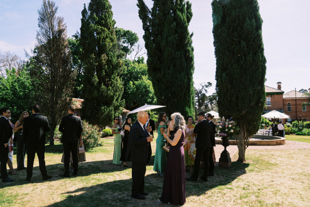 guests waiting in the garden for the ceremony