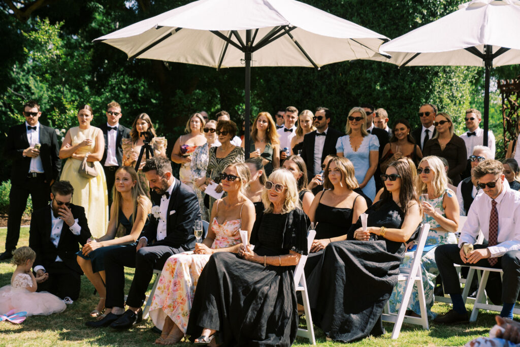 grooms side of the wedding guests during their wedding ceremony